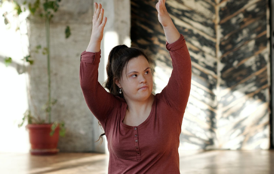 Girl with disability doing yoga