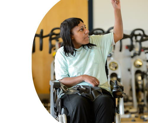 Woman in wheelchair in gym